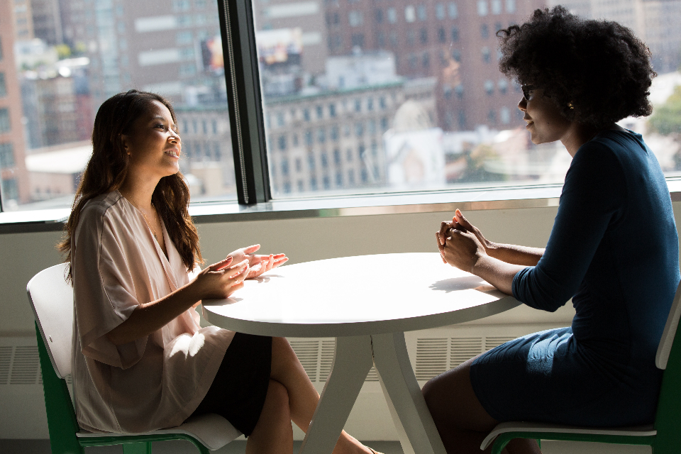 Bilingual team in a business meeting discussing the ROI of a multilingual workforce