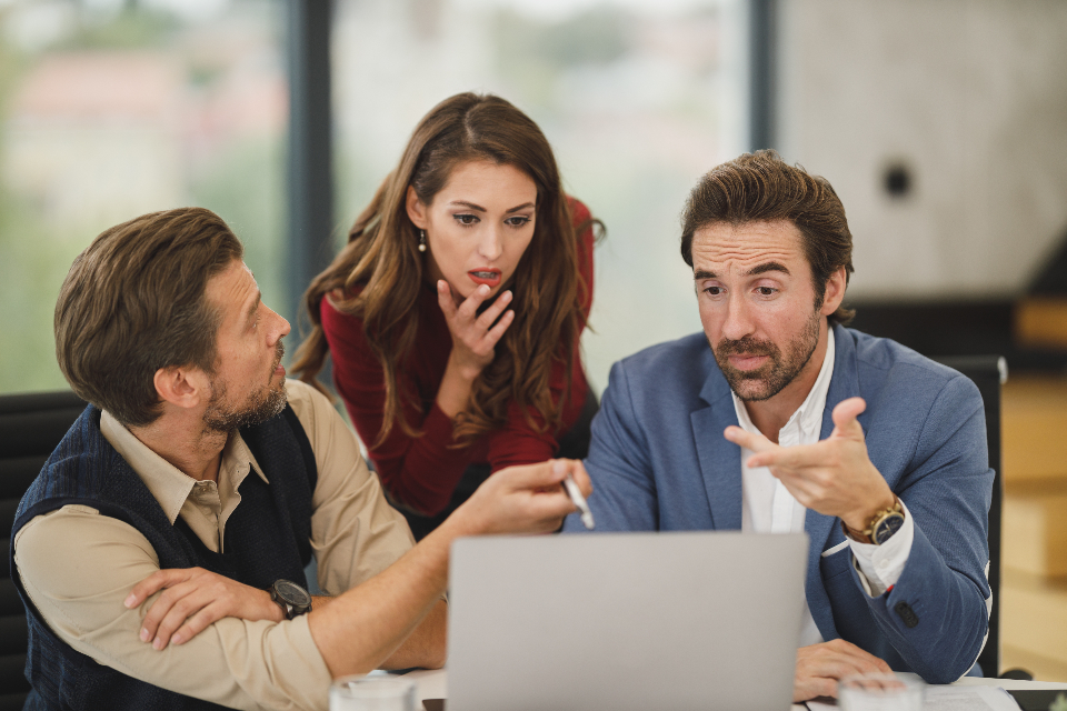 Colleagues collaborating in an office, reflecting the business Spanish skills used across Spanish-speaking markets