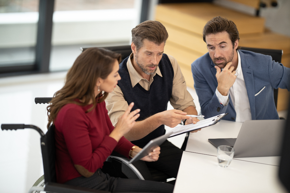 Colleagues from diverse backgrounds collaborating to build cultural competency