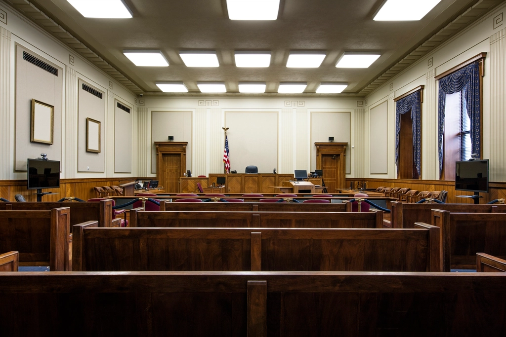 Courtroom interior at a US federal courthouse where legal language proficiency affects case outcomes