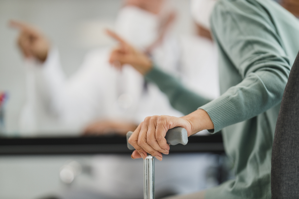 Healthcare professional caring for a senior patient in a hospital setting